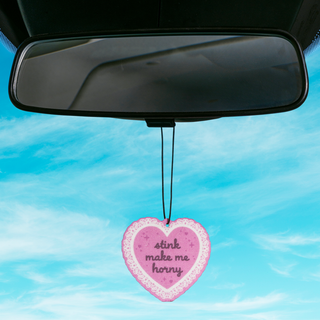 Air freshener with "stink make me horny" text.