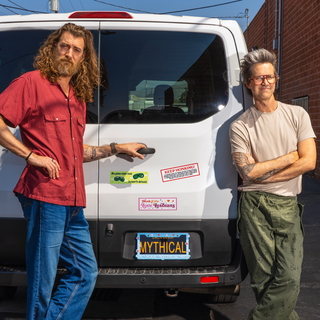 License plate frame: "MYTHICAL BE YOUR MYTHICAL BEST"