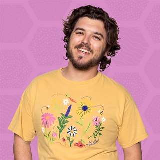T-shirt with floral design and "bee your mythical best" text.