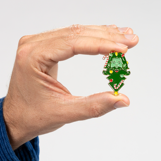 Rhett's Christmas Face pin of the month. Christmas tree face pin with candy cane accents.