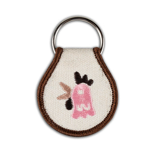 Cozy Mythical Morning Key Tag. Key tag with pink ghost design and brown stitching.