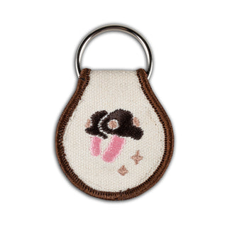 Key tag with a cozy mythical morning design.