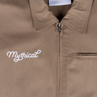 Mythical Work Jacket with YKK zipper, pockets, and "Mythical" script logo.