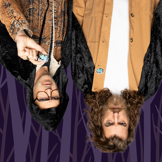 "As You Can See, We Can't Pin of the Month" pin featuring two figures hanging upside down.