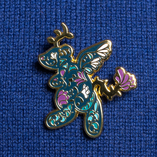 Floral Randler Pin of the Month pin. The pin is gold-plated with a colorful floral design.