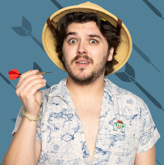 Cartographer Chase Flying Dart Pin of the Month. Angled view of a pin featuring a figure of a man with a worried expression.