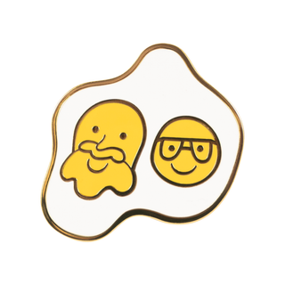 Sunny Side Up Pin of the Month: Pin of a sunny side up egg with two yolks, one with a beard and one with glasses.