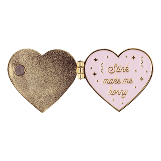 Stink Make Me Horny Locket Pin of the Month: Open heart locket pin with "Stink make me horny" text inside.