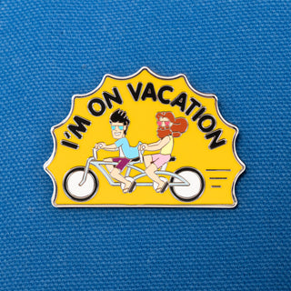 Two Men On A Double Bike Pin of the Month with "I'm On Vacation!" text.