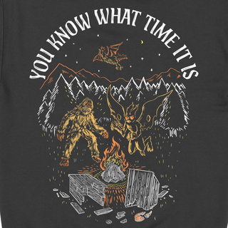Hoodie with Bigfoot, Mothman, and bat design. "You Know What Time It Is" text. Glow-in-the-dark embroidery.