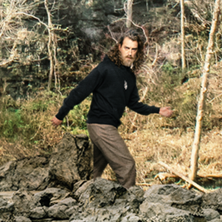 GMM Glow-in-the-Dark Bonfire Hoodie with glow-in-the-dark Bigfoot and Mothman embroidery. Premium cotton hoodie.